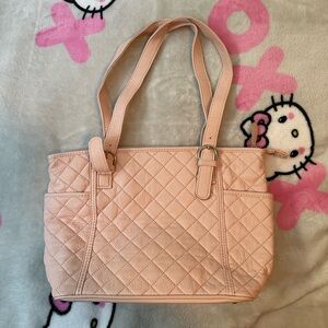 Women’s quilted salmon pink purse with zippers and compartments